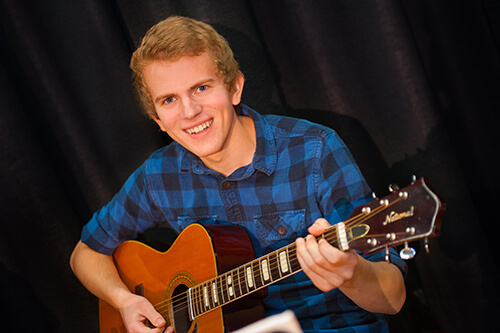 Student Playing Guitar