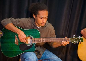 Student Playing Guitar