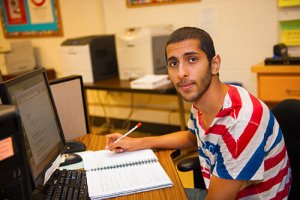 Student Writing At Computer